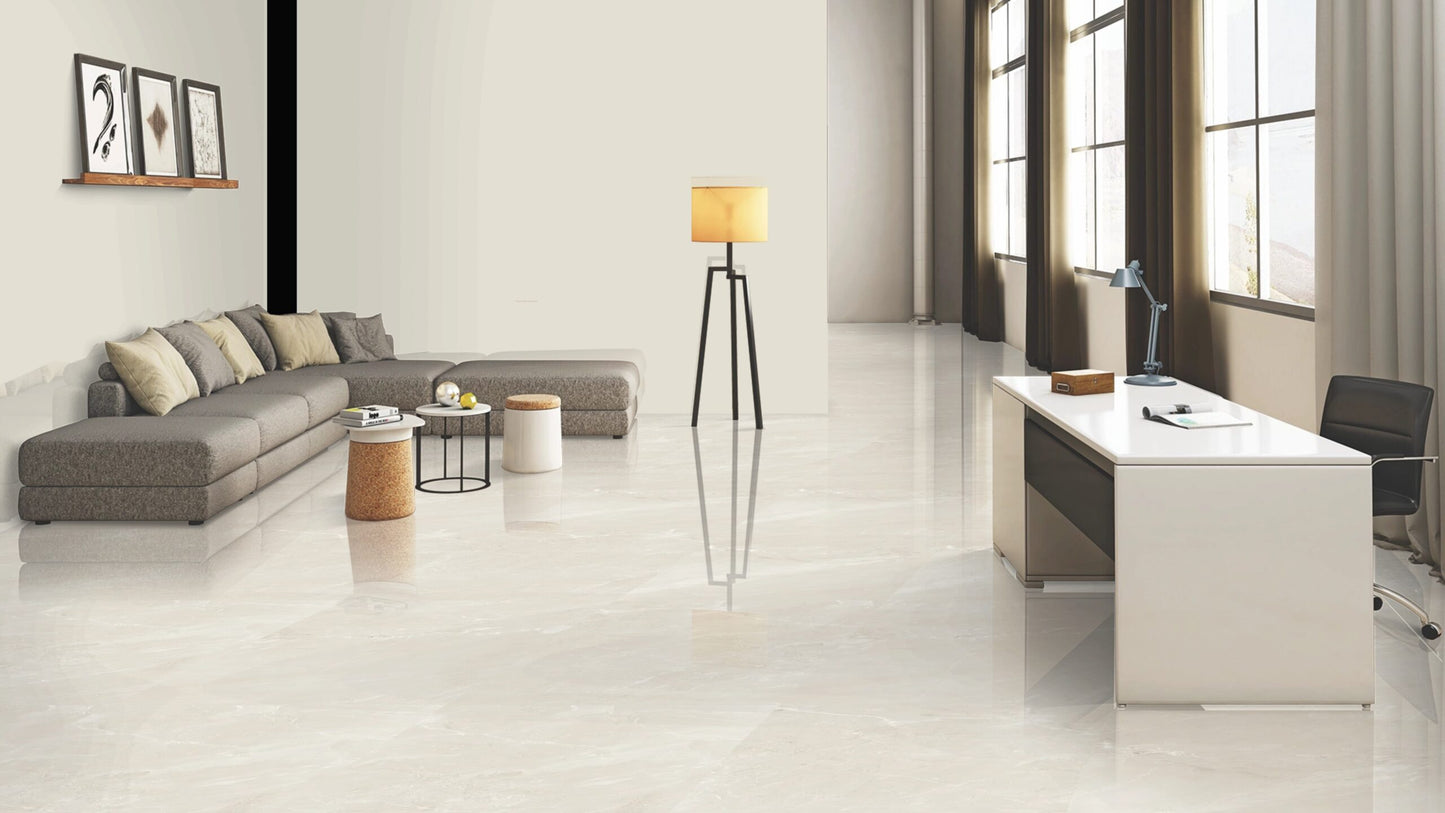 Modern office interior with a desk, lamp, and sofa.